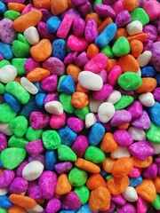 Close up top view of colorful stone suitable for background design. Each stone has a unique shape, adding visual interest to the arrangement.