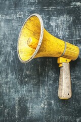 Vintage Yellow Megaphone on Dark Textured Background