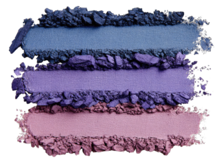 Crushed eyeshadow pigments in shades of deep blue, violet, and mauve, displayed in horizontal layers
