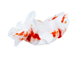crumpled tissue with isolated red blood stains on a white background