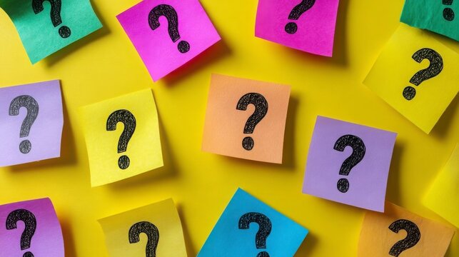 Colorful Sticky Notes with Question Marks on Yellow Background