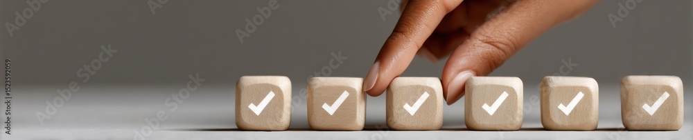 Aufkleber modern task management concept with hand arranging wooden cubes featuring check marks for systematic