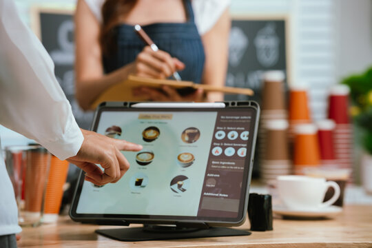 A smiling barista serves a customer at a modern café counter, showcasing friendly service, small business spirit, and coffee culture. - Powered by Adobe
