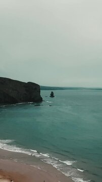 Scenic view of the rugged coastline of Odeceixe Beach in Portugal
