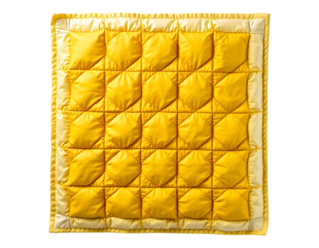 Close-up of a square yellow quilted fabric with a diamond pattern