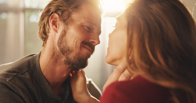 Home, love and couple with smile, marriage and bonding together in living room. People, apartment and man with woman, support and trust with kindness, commitment and romantic with affection or care