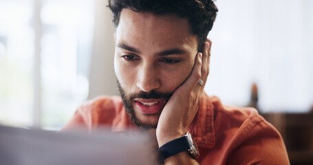 Stress, finance and man with paperwork in home for mortgage debt, loan payment and taxes. Worry, apartment and person with documents, bills and report for budget, financial crisis and review savings