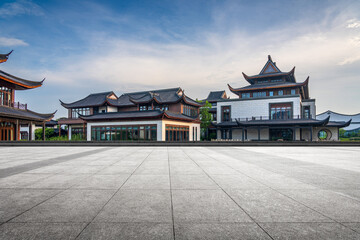 Contemporary Asian Architecture with Traditional Roof Designs Against a Clear Sky