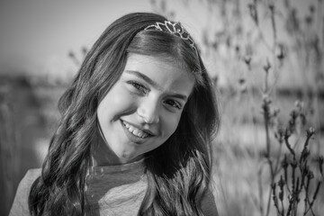 High resolution image of a single beautiful twelve year old Caucasian girl photo shot outdoors