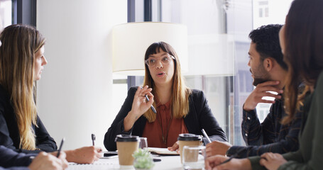 Business people, meeting and woman in office, conversation and planning for magazine publication. Group, employees and journalists in workplace, discussion and brainstorming for article and editor