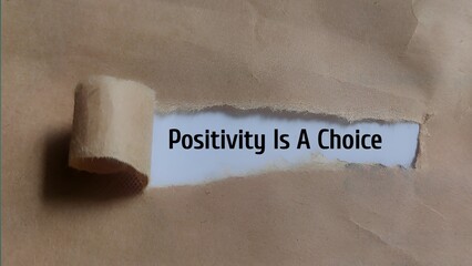 Positivity Is A Choice - Uplifting Message Revealed Through Torn Brown Paper