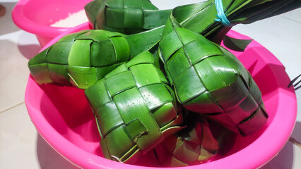 Ketupat Lebaran. Eid celebratory dish of rice cake or Lebaran menu, Ketupat. Food Festive for...