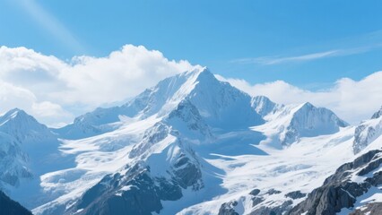 Obraz premium Snow-Capped Mountain Peaks Under a Clear Blue Sky