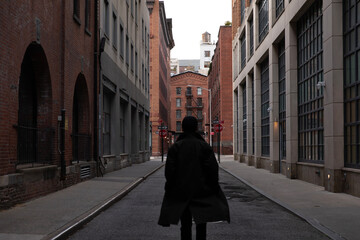 Person walking down the street in Tribeca New York City	