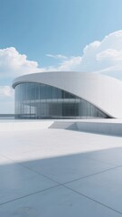 Obraz premium Modern Curved Building with Glass Facade Under Clear Sky