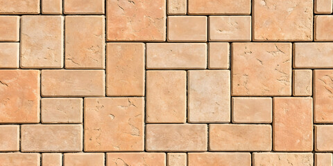 Peach colored sandstone tiles in mixed rectangular sizes showing natural stone variation and consistent installation pattern.