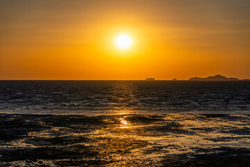 tranquil seascape of sunset at the island