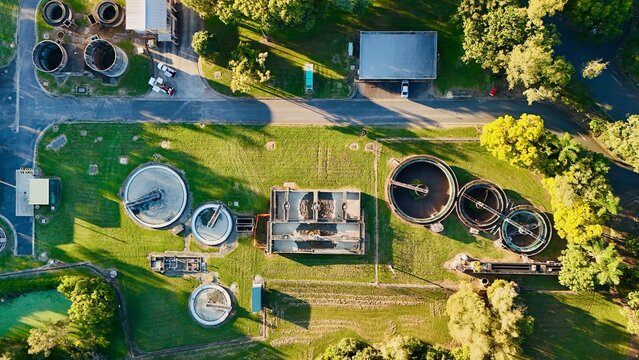 Carole Park STP, Brisbane, Queensland, Australia: Aerial Image of Circular Clarifiers, Settling Tanks, Algal Pond, and Water Treatment Infrastructure at a Modern Sewage Treatment Plant in a Green