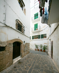 Streets and views of the ancient walled citadel of Dalt Vila, a UNESCO World Heritage Site, on the island of Ibiza in Spain.
