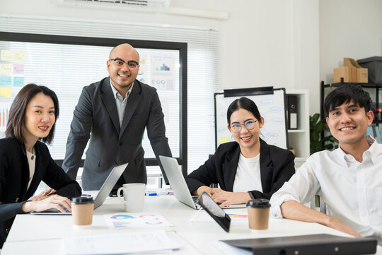 Asian business people team analyzing statistics financial. Group Team of ceo business man and woman Meeting Conference Discussion various topic. Executive professional managers Corporate in office.