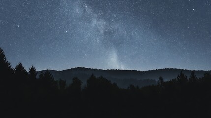 Fototapeta premium Starry night over distant forested hills