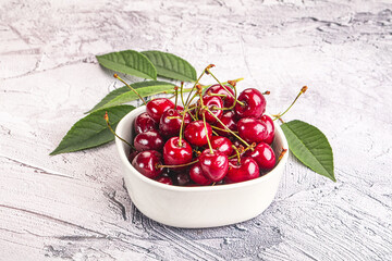Red sweet cherry in the bowl