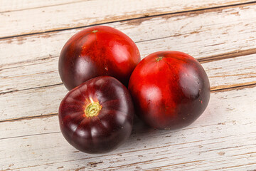 Black ripe juicy organic tomato