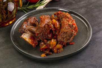 Baked beef ribs with vegetables