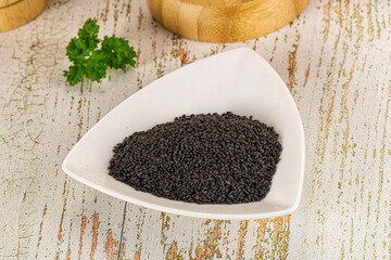 Black dry Nigella seeds in the bowl