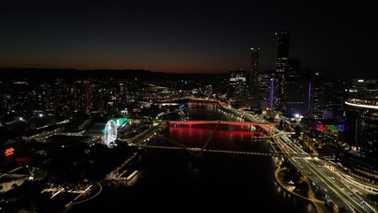 Brisbane CBD, Queensland, Australia, May 22, 2025: Aerial Image at Night Showing Skyscrapers, City Lights, the Wheel of Brisbane, Bridges, Riverfront, and South Bank Cultural Precinct After Sunset
