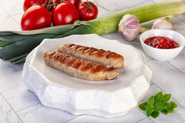 Grilled pork sausages served tomato sauce