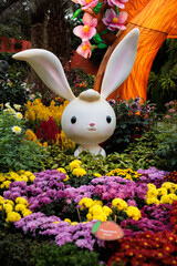 Cute and adorable cartoon-like rabbit emerging from flowers at gardens by the bay - Singapore