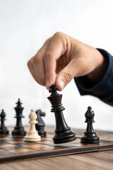 Hand selecting king chess piece symbolizing leadership, strategy, and business planning