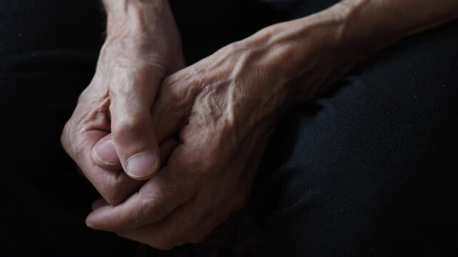 wrinkled sinewy hands of an old man close-up. emotions of older people. lonely pensioner concept. old age