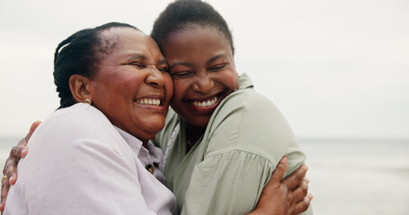 Mature mother, daughter and hug on beach for travel, holiday and getaway trip. Women, African...