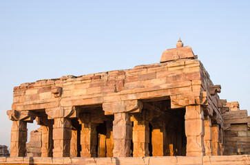 Fototapeta premium The ancient temple of Hindu god at Sunrise, temple complex, group of monuments in the Aihole village, Badami, Karnataka, India.