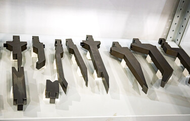 Precision metal cutting tools and dies arranged in industrial workshop. CNC machining equipment...