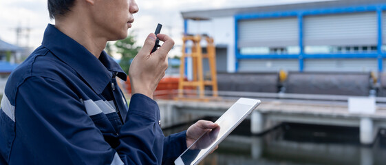 maintenance and inspector. Maintenance engineers are using walky talky to inform the results of...
