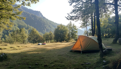 Tourist camp in the mountains, tent in the foreground