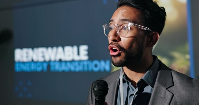Renewable energy, speaker or man in seminar speech for ecology, awareness or forum. Presentation, event or keynote guest on stage in summit discussion for sustainability or eco friendly convention