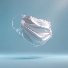 Floating White Medical Mask on Soft Blue Gradient Background