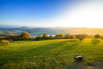 View of the landscape at the Meerfelder Maar. Nature at the crater lake in the Volcanic Eifel National Park. The surrounding area near Meerfeld at sunset in the evening.
