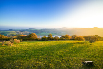 View of the landscape at the Meerfelder Maar. Nature at the crater lake in the Volcanic Eifel National Park. The surrounding area near Meerfeld at sunset in the evening.  © Elly Miller