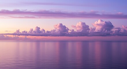 Obraz premium Serene seascape with purple clouds at sunset reflecting on calm ocean water
