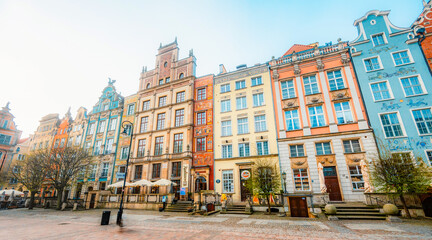 Fototapeta premium Gdansk with Motlawa river in Poland. Old town colourful house with saint Marys church i main square..