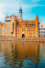 Fototapeta premium Gdansk with Motlawa river in Poland. Old town colourful house with Holy Spirit Gate