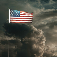 American flag waving under a cloudy sky