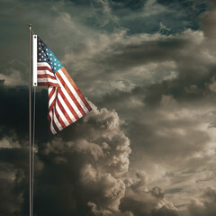 American flag waving under a cloudy sky