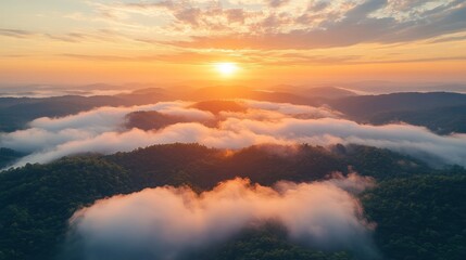 A breathtaking sunrise over rolling hills with layers of clouds and mist creating an ethereal landscape view.