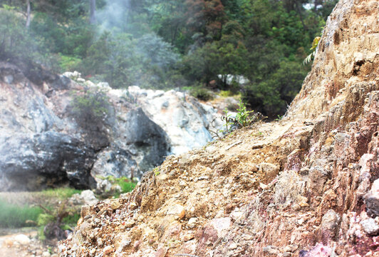 Volcanic Rocks with Sulfur Mist Background